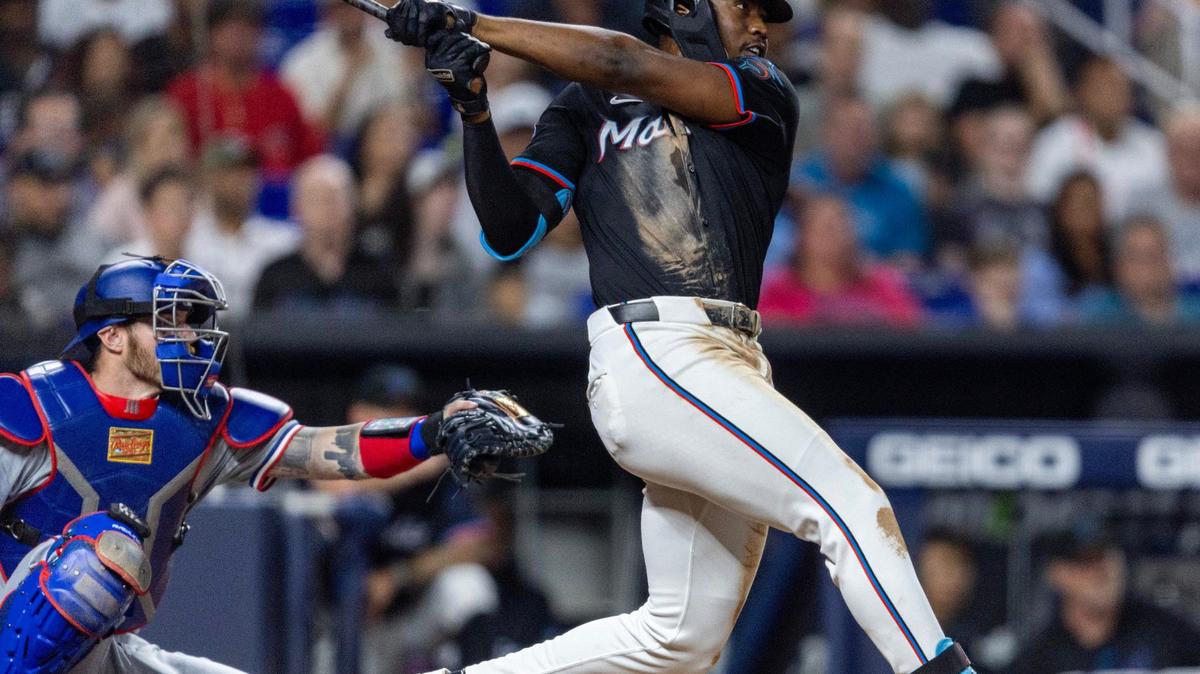 Miami Marlins batter Jesus Sanchez (12) hits a three-run home run during the seventh inning of an MLB game against the Texas Rangers at LoanDepot Park on Friday, May 31, 2024, in Miami, Fla.