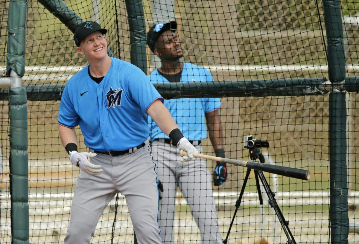 Miami Marlins first baseman Garrett Cooper (26) bats during the spring training workout at Roger Dean Stadium on Thursday, February 20, 2020 in Jupiter, FL.