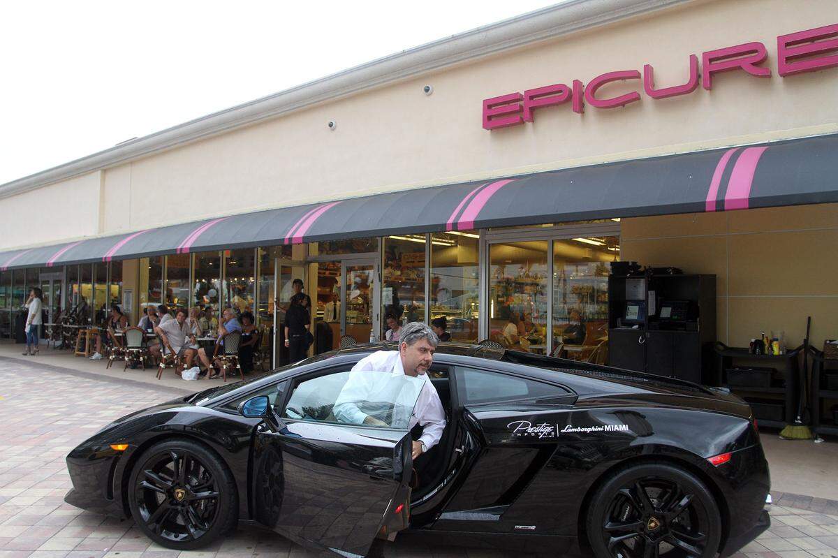 Dominick Raneri, finance director at Prestige Imports, parks an LP 560 Lamborghini at Epicure Sunny Isles Beach as Epicure and Prestige Imports host their monthly Lamborghini-tini event bringing Lamborghinis, cocktails and food all to one place at Epicure on Saturday, Sept. 3, 2011. The event takes place the first Saturday of every month at Epicure in Sunny Isles Beach.