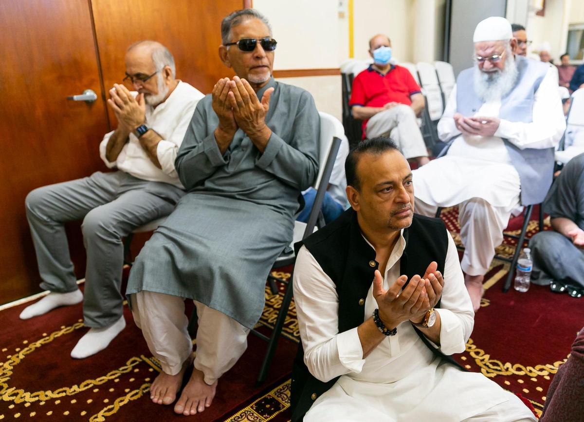 Amir Khan, bottom-right, performs the Eid al-Adha prayer at the Islamic Center of Greater Miami on Saturday, July 9, 2022, in Miami Gardens, Fla.