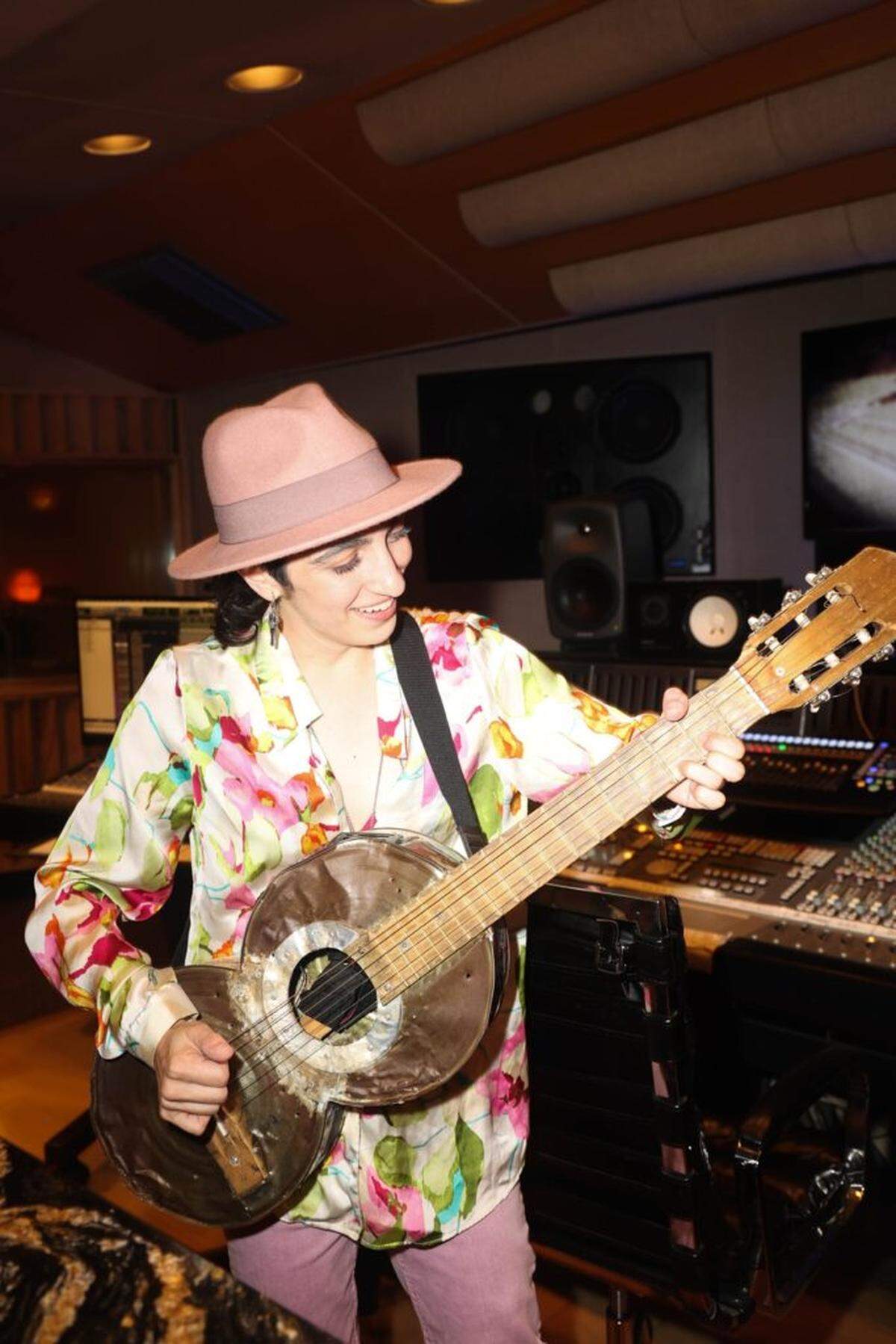 Emily Estefan plays one of the recycled guitars. She’s co-writing the music and lyrics for the musical “Basura” based on the Recycled Orchestra of Cateura.