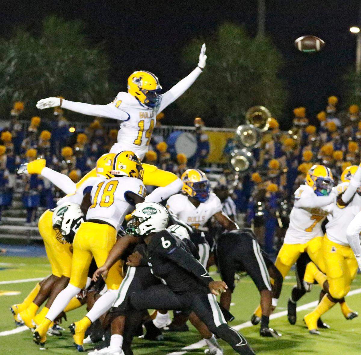 Northwestern Bulls attempt to block a field goal during Region 4-2M semifinal playoff football game against Miami Central Rockets on Friday, November 18, 2022 at Traz Powell Stadium in Miami. Andrew Uloza / for Miami Herald