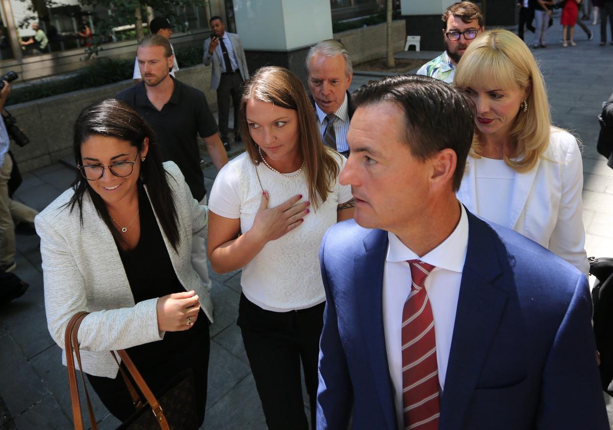 Bradley Edwards leaves the courthouse with Epstein accuser Courtney Wild (left of Edwards) and attorney Sigrid McCawley on Monday, July 15, 2019.