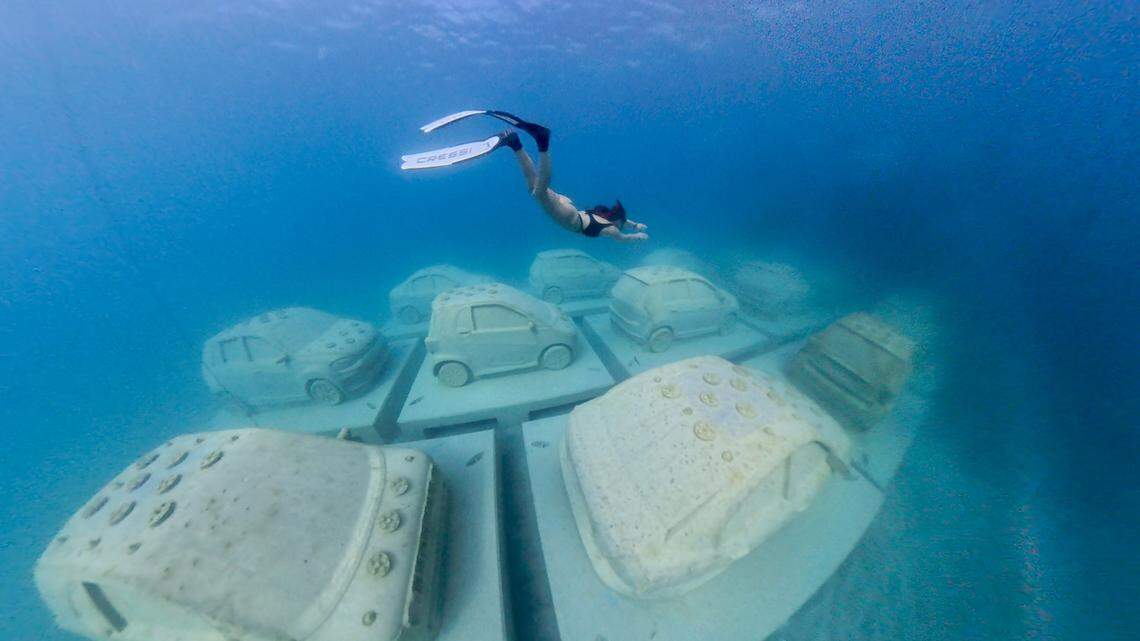 Cars on the ocean floor as part of the Reefline project.