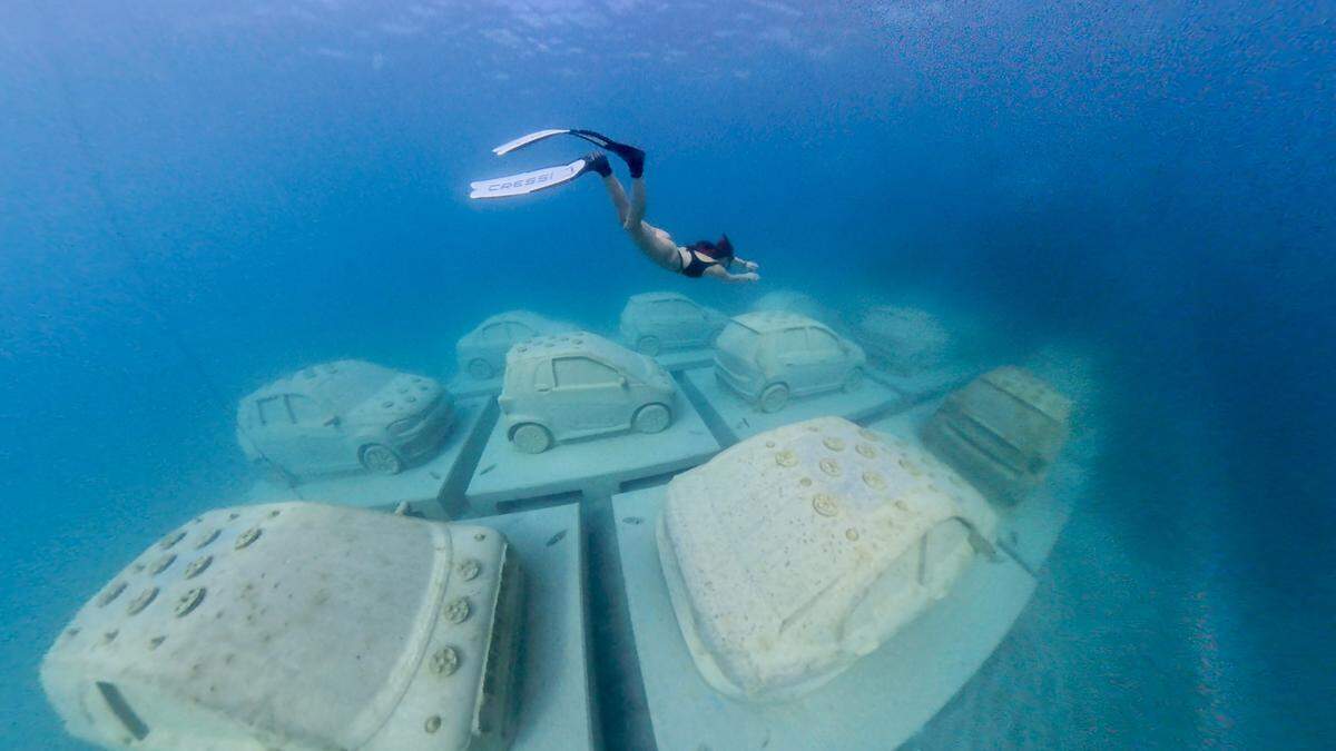 Cars on the ocean floor as part of the Reefline project.