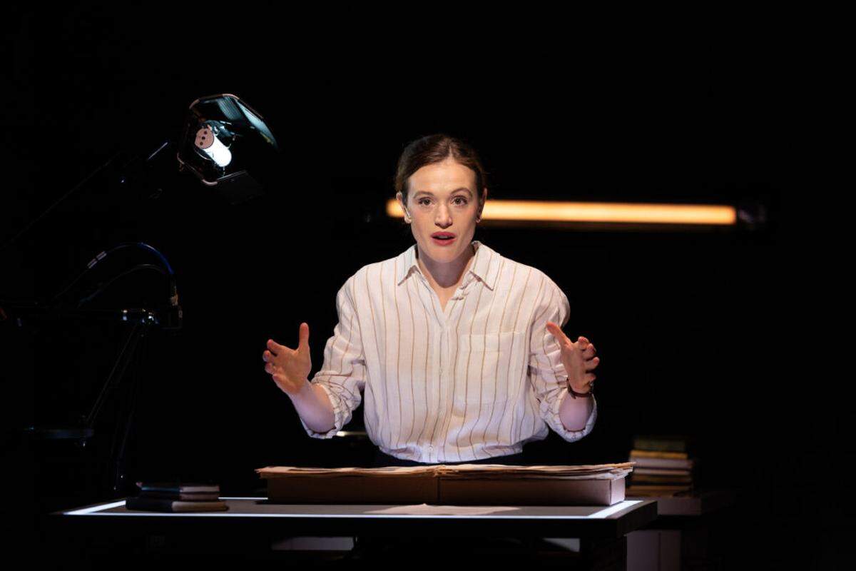 The primary researcher, Rebecca Erbelding (Delia Cunningham), is at the center of “Here There are Blueberries” at Miami New Drama.