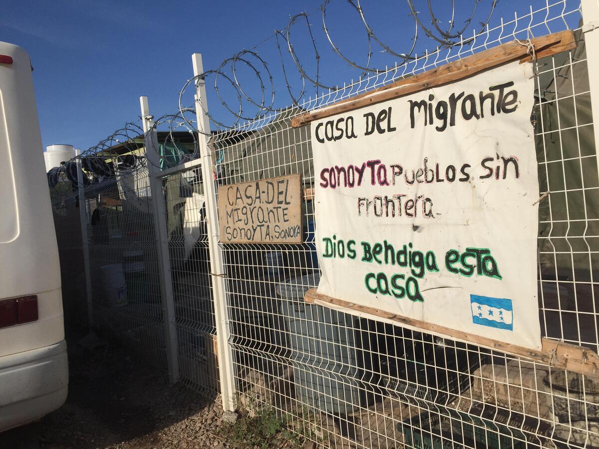 A sign marks the entrance to a makeshift immigrant camp on the outskirts of Sonoyta, a remote Mexican border city across from Lukeville, Arizona, Dozens of mostly Central American immigrants stay here before making their attempt to sneak into the United States across the rugged, mountainous desert,
