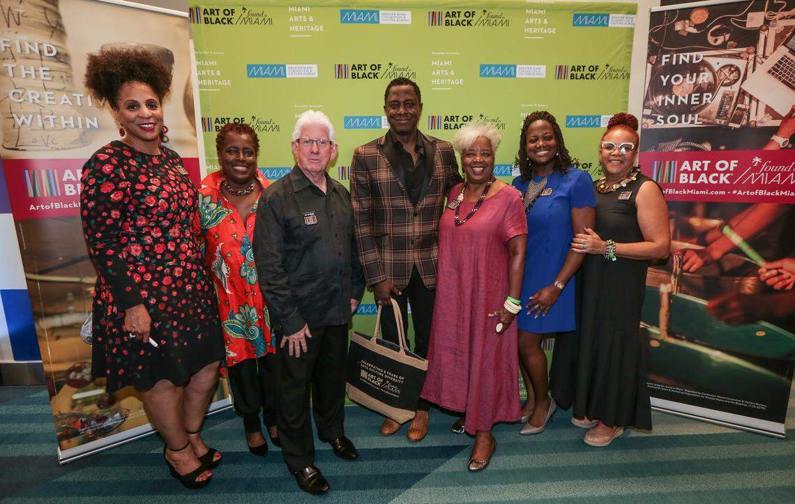 From left: Connie W. Kinnard, the Greater Miami Convention & Visitors Bureau vice president of Multicultural Tourism & Development; Graylyn Swilley-Woods, Overtown Children & Youth Coalition director; William D. Talbert III, GMCVB president & CEO; featured artist Sanford Biggers; Carole Ann Taylor, GMCVB Multicultural Tourism Committee chairwoman; Petra Brennan, GMCVB, director of Tourism Business Enhancement; and Rosie Gordon-Wallace, GMCVB, art consultant, Art of Black Miami .