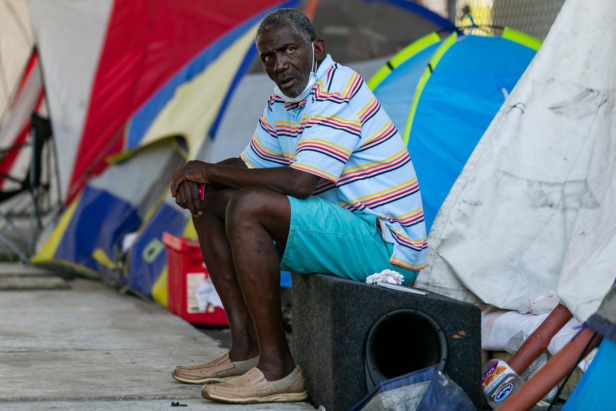 Conroy Mathis, 68, spends time near Northwest 11th Street and Northwest 3rd Avenue in MiamiÕs Overtown district as concerns over COVID-19 continue to spread through South Florida on Tuesday, April 14, 2020.