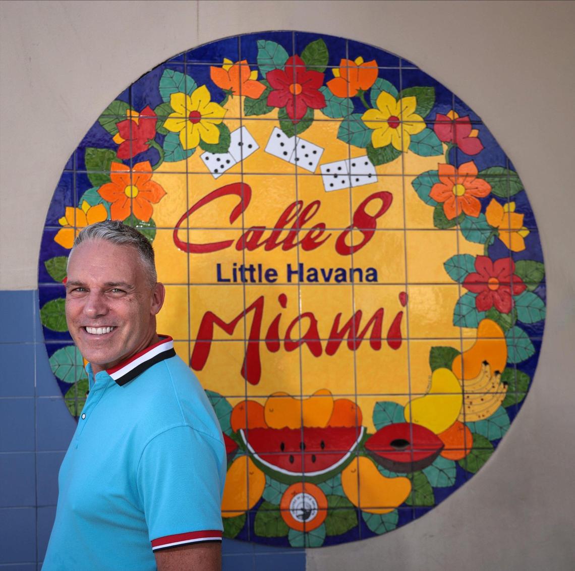 Jaie Laplante, executive director of the Miami Film Festival and operator of the Tower Theater, stands outside the historic Little Havana theater under its marquee.