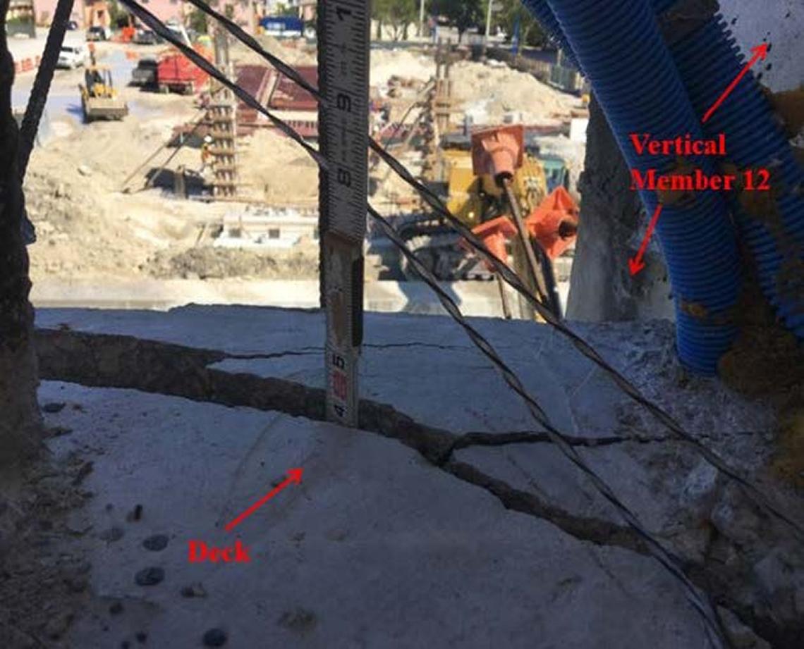 A measuring stick shows the depth of a crack in the deck of the doomed FIU bridge. This photo was dated March 13, 2018, two days before the bridge collapsed, killing six.