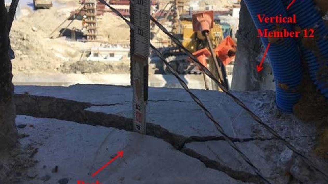 A measuring stick shows the depth of a crack in the deck of the doomed FIU bridge. This photo was dated March 13, 2018, two days before the bridge collapsed, killing six.