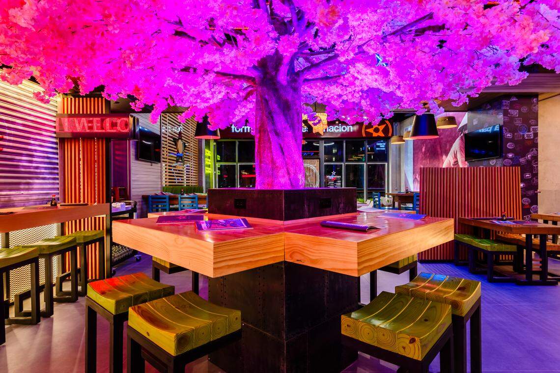 The giant neon cherry blossom tree at Nacionsushi in Doral.