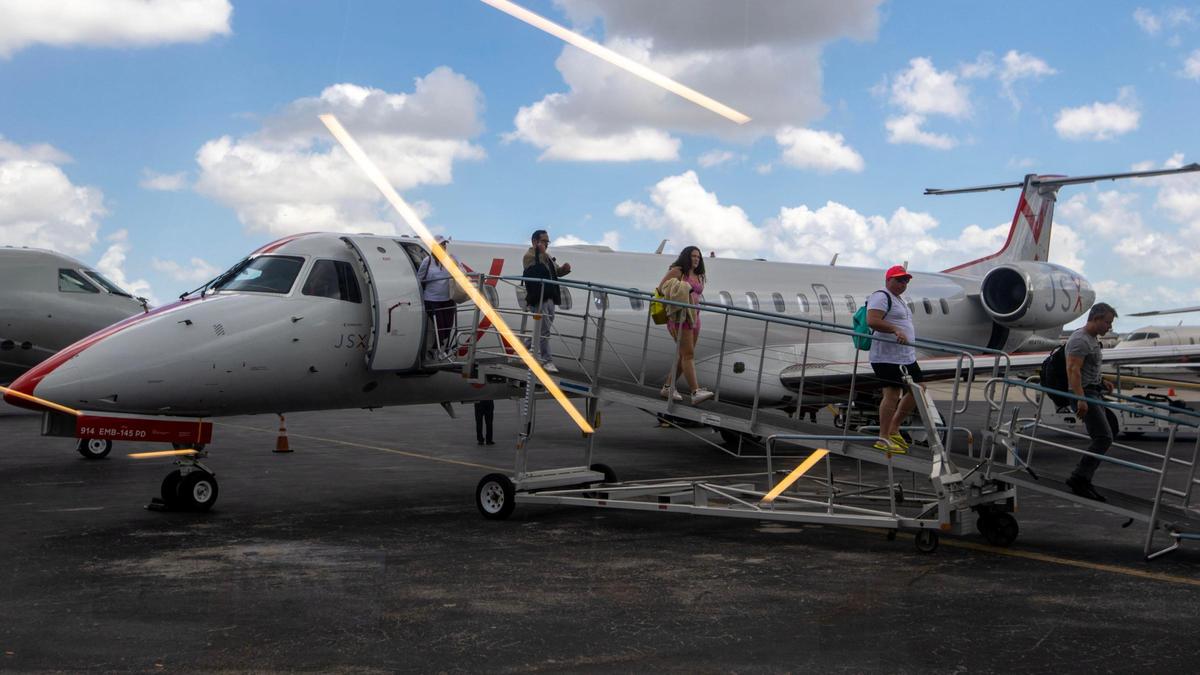 Private flyers deplane their flight at JSX Terminal in Miami, Florida, on Friday, April 21, 2023.