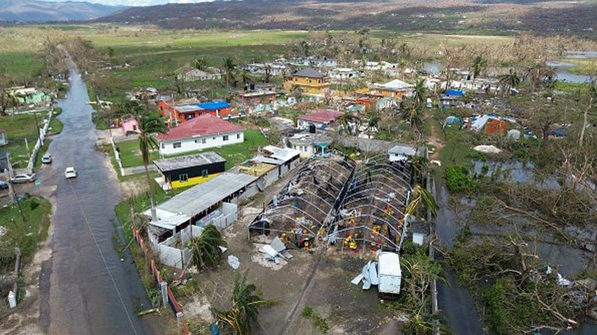 TOPSHOT - Flooding and damaged buildings are seen in the aftermath of Hurricane Melissa in Lacovia, St Elizabeth, Jamaica, on October 31, 2025. At least 19 people in Jamaica have died as a result of Hurricane Melissa which devastated the island nation when it roared ashore this week, a government minister told news outlets late October 31. (Photo by Ricardo Makyn / AFP) (Photo by RICARDO MAKYN/AFP via Getty Images)