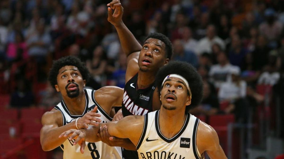 Miami Heat center Hassan Whiteside fights for position under the basket against Brooklyn Nets guard Spencer Dinwiddie (8) and center Jarrett Allen (31 during the third quarter of an NBA basketball game at the AmericanAirlines Arena in Miami on Saturday, March 31, 2018.