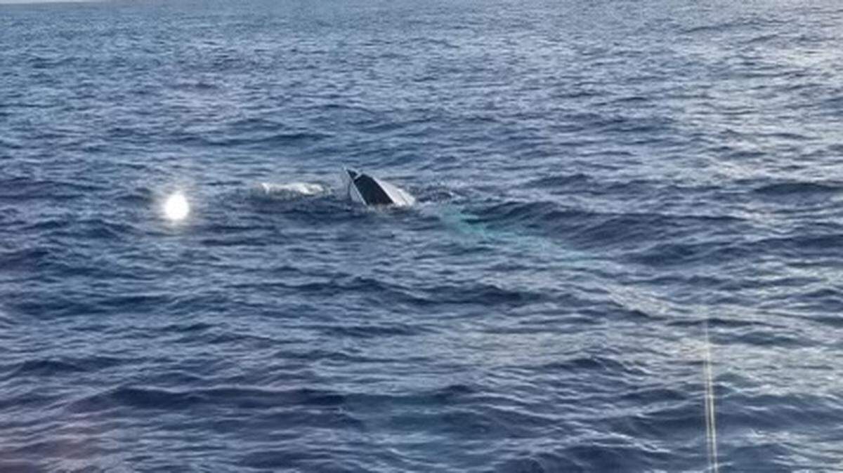 The U.S. Coast Guard and a good Samaritan rescued a man about 23 miles east of Fort Pierce after this boat capsized Feb. 10, 2021. The search continues for six more people.