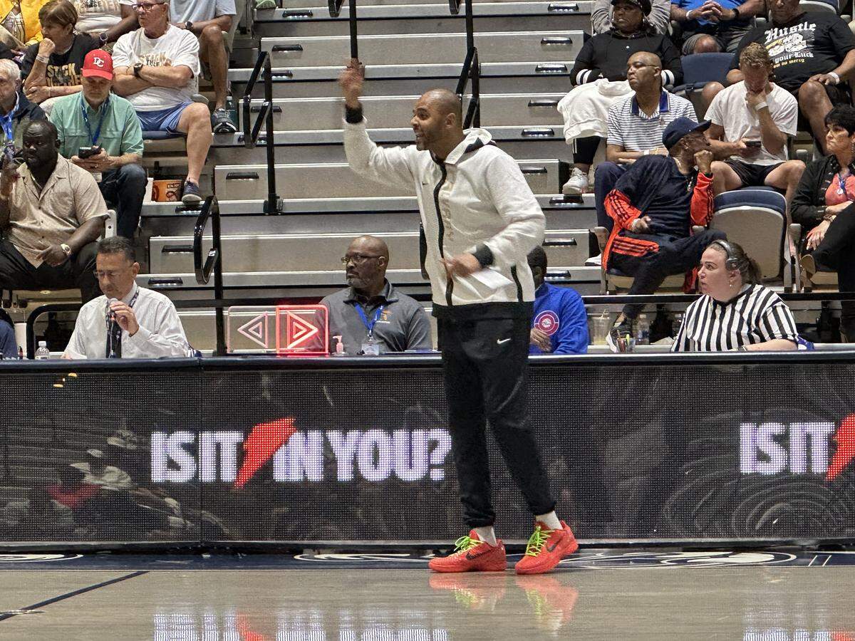 Calvary Christian boys’ basketball coach Cilk McSweeney yells instructions to his players during Wednesday night’s Class 3A state championship game at UNF Arena in Jacksonville, Fla.
