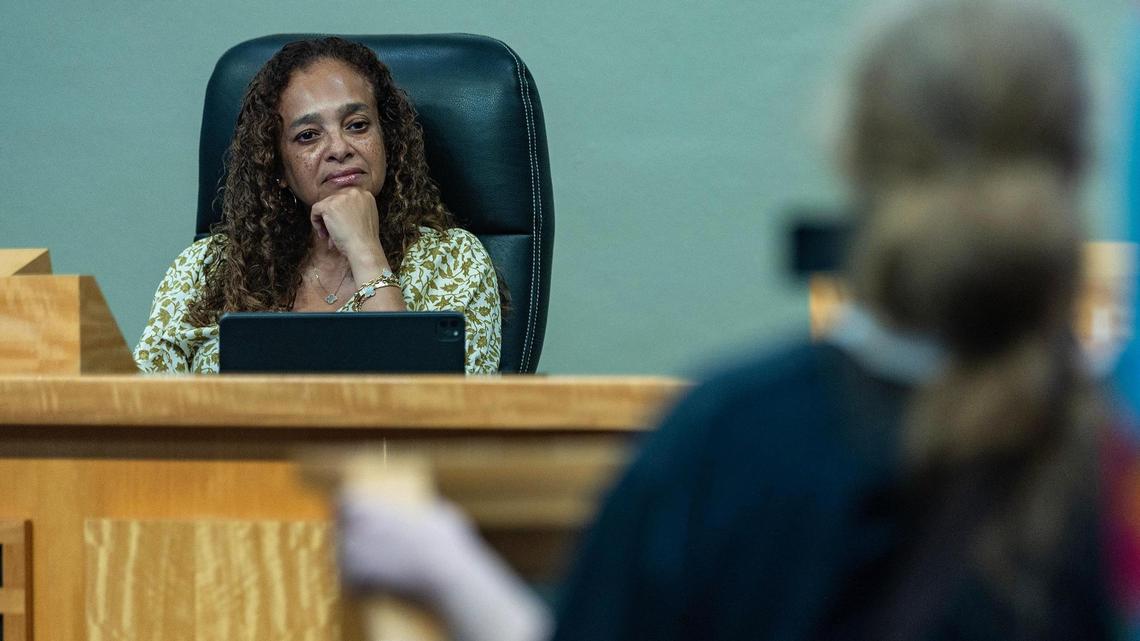 City of Miami Commission Chairwoman Christine King listens to a resident during a meeting to decide how to temporarily fill the District 1 seat left vacant after the arrest and suspension of Alex Diaz de la Portilla, at City Hall on Saturday September 23, 2023.