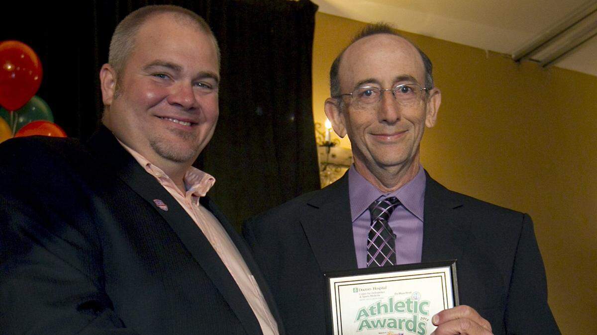 Former Miami Herald sportswriter George Richards, left, and Larry Blustein with his courage award at The Miami Herald Athletic Awards Breakfast at Signature Grand in Davie May 24th, 2013.