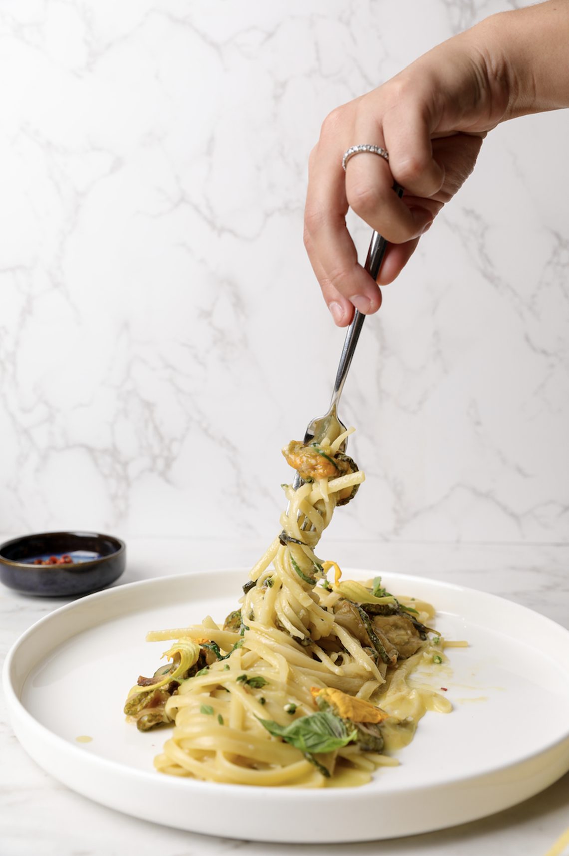 Pasta alla Nerano (spaghetti with fried zucchini and provolone) is one of the specialties at Like Mike.