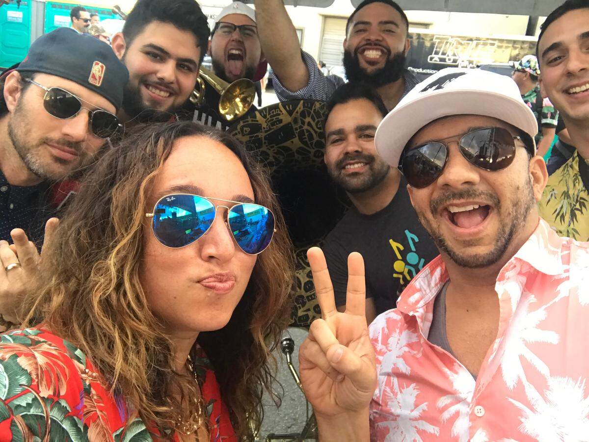 Power 96’s Lucy Lopez and DJ Zog pose with fans at the 2019 305 Day Block Party.