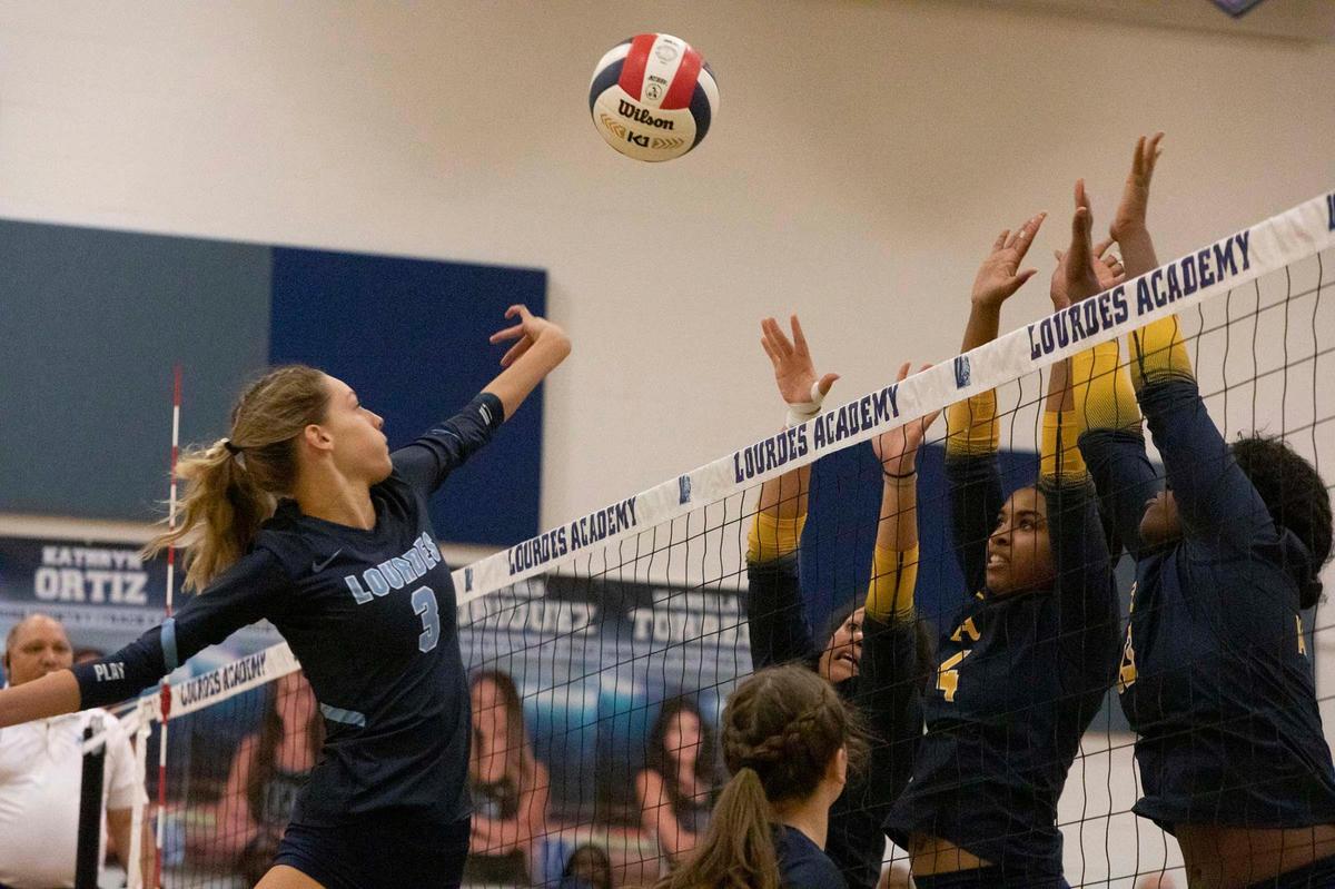 Lourdes #3 Oliva Guzman spikes the ball during St. Thomas Aquinas vs Lourdes at Our Lady of Lourdes Academy,, Miami, FL.