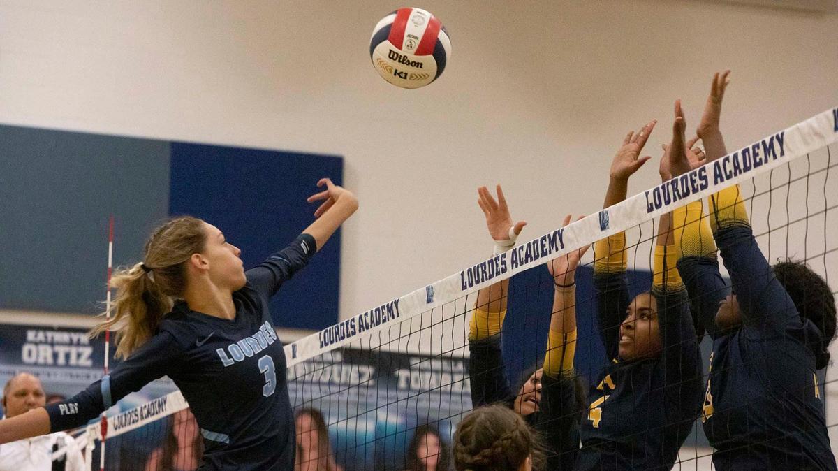 Lourdes #3 Olivia Guzman spikes the ball against St. Thomas Aquinas’ front line during the Region 4-6A final.
