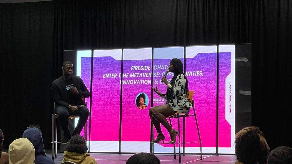 Two speakers discuss technology trends at the Black Innovation Technology and Entertainment Conference in Miami in 2022.