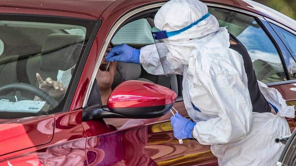A Miami-Dade County resident gets a COVID-19 test at the drive-through facility at Marlins Park. The latest US News report examines which U.S. cities are the healthiest in light of the coronavirus pandemic.