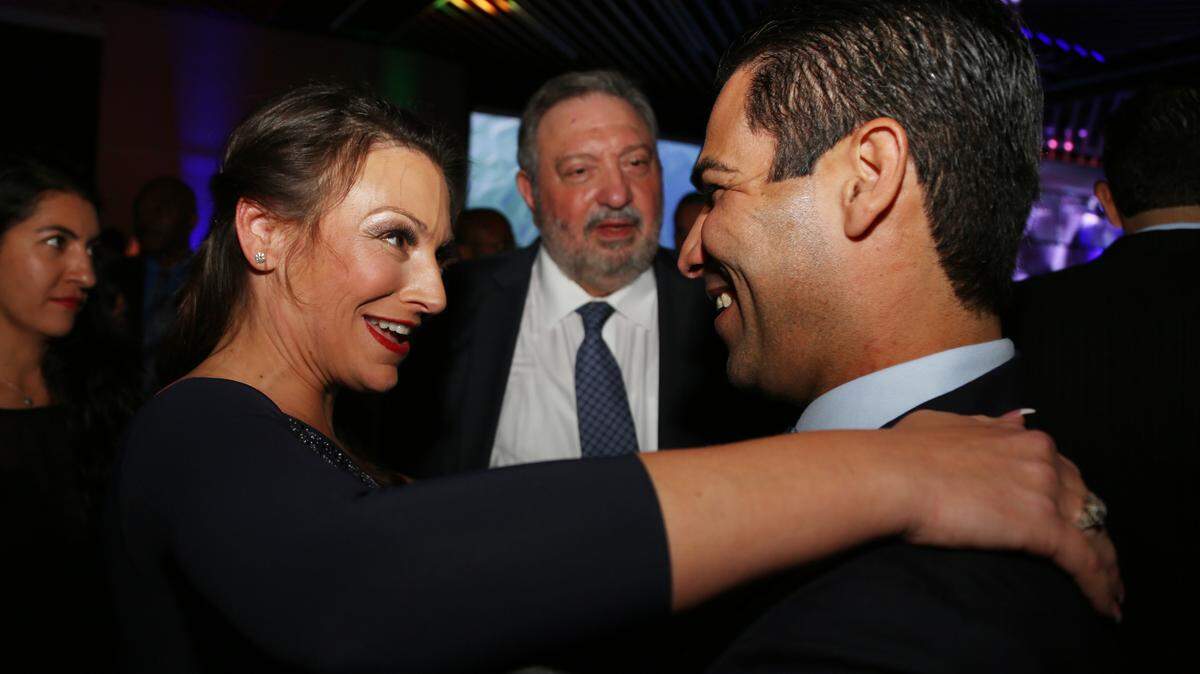 Florida Agriculture Commissioner-elect Nikki Fried, greets Miami Mayor Francis Suarez Monday night, Jan. 7, 2019, at the Champions Club at Florida State University’s Doak Campbell Stadium during an inaugural ball. Center is attorney Louis Terminello, Miami.