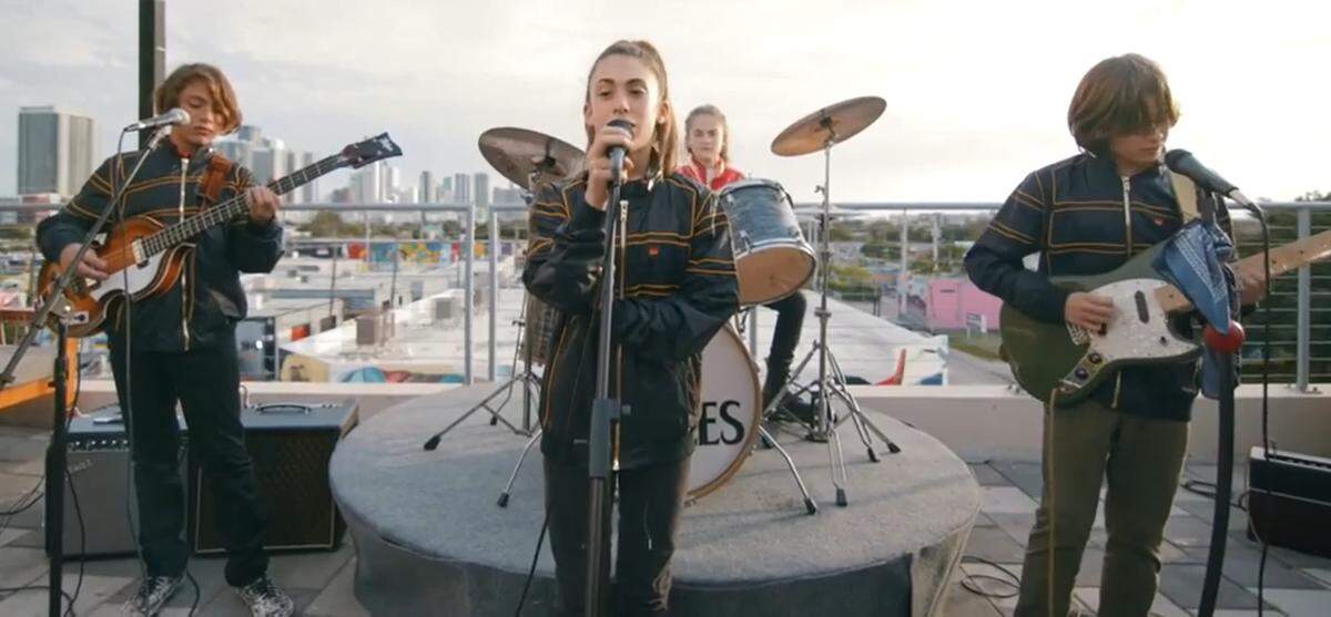 The Sunset Four in a screen grab from a video as they play on the rooftop of Astra Miami on Jan. 30, 2021. The Beatles’ tribute band are Warren Bromley, 13, on bass, Zoe Lyons, 13, on lead vocals, Evangeline Lyons, 13, on drums and Oliver Lieberman, 13, on guitar and vocals. The four are students at Miami Beach Nautilus Middle School.