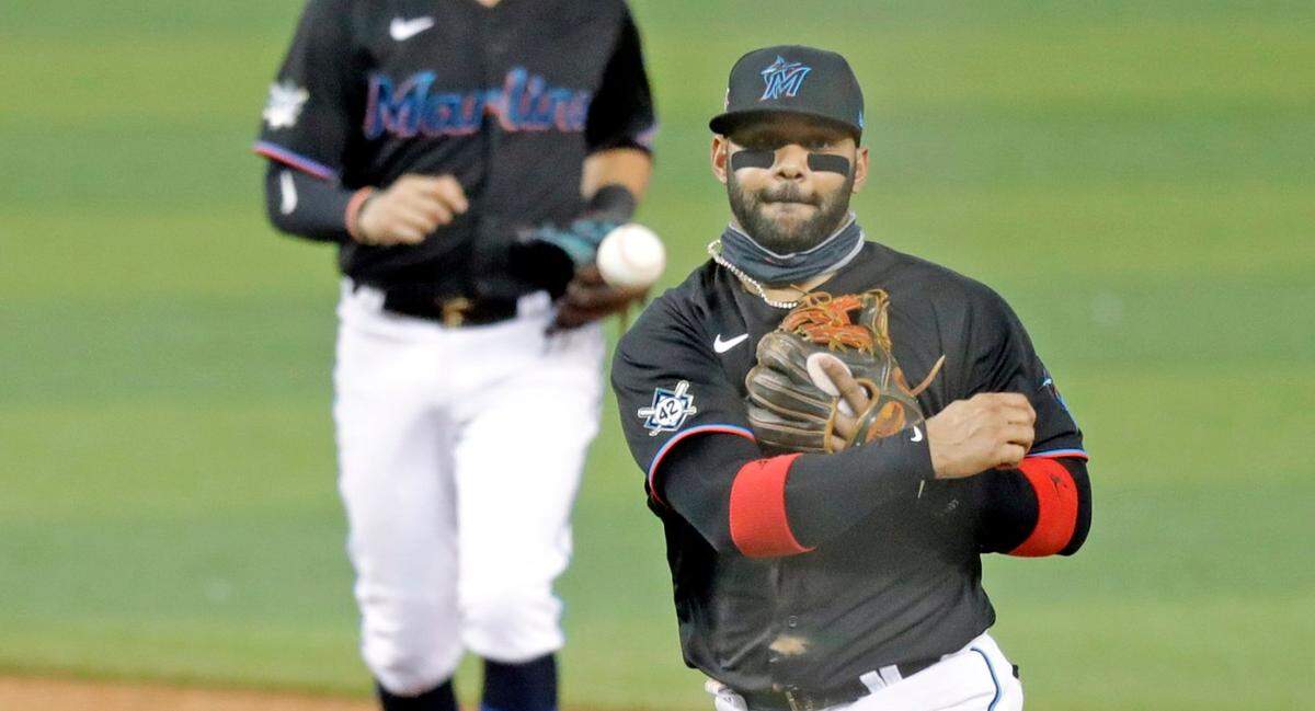 Miami Marlins second baseman Jonathan Villar (2) throws to first base as the Miami Marlins host the Tampa Bay Rays at Marlins Park in Miami on Saturday, August 29, 2020.