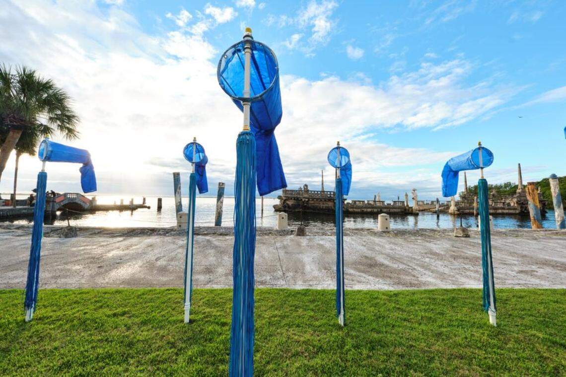 Along the bayfront, the windsocks rise in shades of blue that echo the sky and the sea. Headwind” by Susanne Schirato, commissioned by the Contemporary Arts Program (CAP) at Vizcaya Museum and Gardens, 2025.