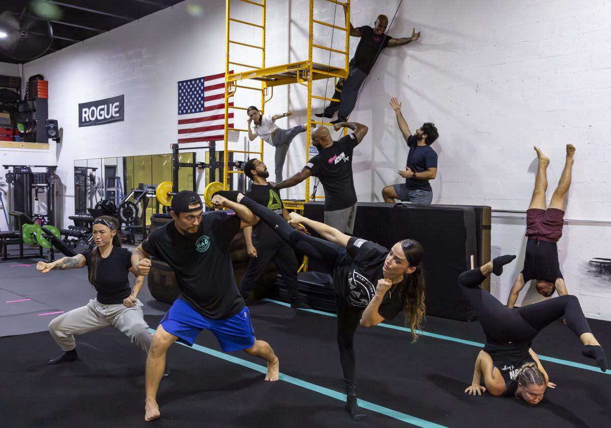 From left to right: Ashley Dwyer, 34, Christopher Bogdanski Shore, 31, Jalen Dominguez, 26, Micheli Lima, 34, Chris Henderson, 48, Ekandem Essiet, 41, Yessenia Cossio, 35, Sina Zolghadr, 33, Yana Zemlyanska, 28, and Ryan De Leon, 26, are photographed inside Miami Action Design on Tuesday, Aug. 12, 2025, in Miami, Fla. Miami Action Design is the first stunt gym in Miami-Dade County and offers classes that teach members how to become stunt performers for movies and television.