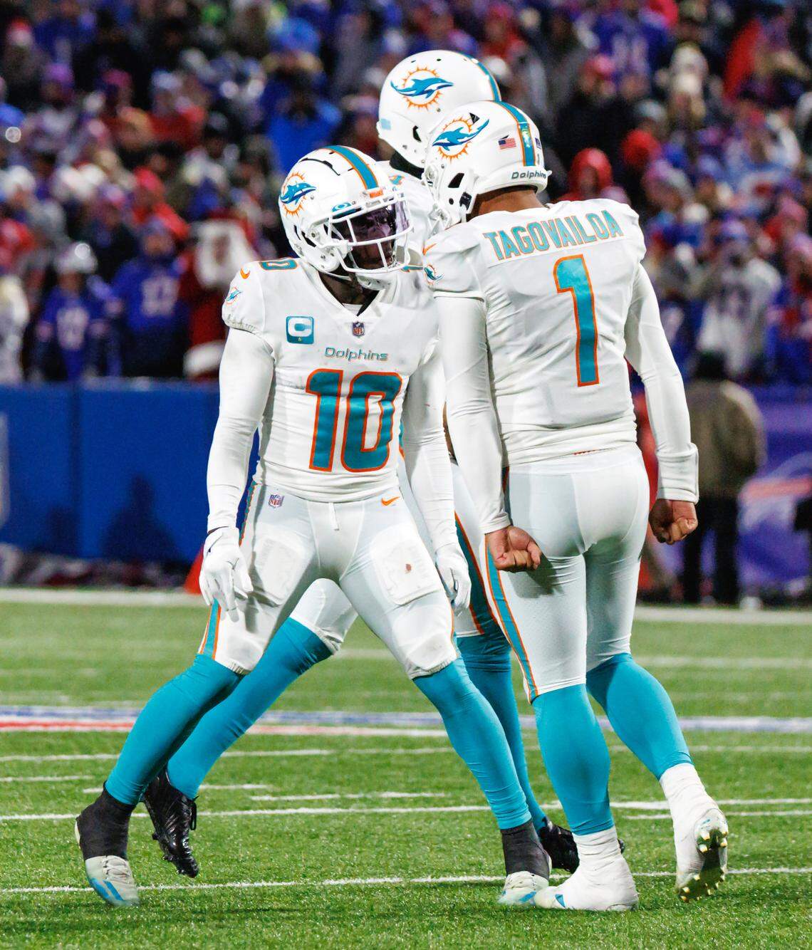 Miami Dolphins wide receiver Tyreek Hill (10) and quarterback Tua Tagovailoa (1) celebrate a touchdown against the Bills in Buffalo earlier this season. Miami hosts the Tennessee Titans on Monday night.