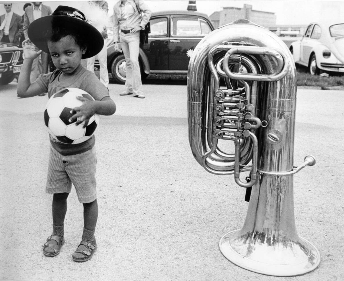 Miro Magloire, 3 1/2 years old at the time, had no idea why photographers were paying attention to him as Haiti’s 1974 World Cup team arrived in West Germany. He became the team’s unofficial mascot and is today an acclaimed choreographer in New York.