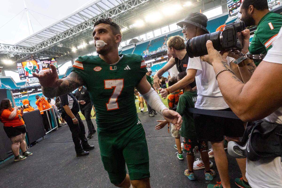 Miami Hurricanes wide receiver Xavier Restrepo (7) reacts with fans after UM defeated Duke 53-31 during an ACC football game at Hard Rock Stadium on Saturday, Nov. 2, 2024, in Miami Gardens, Fla.