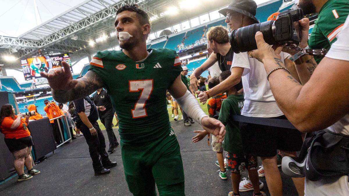 Miami Hurricanes wide receiver Xavier Restrepo (7) reacts with fans after UM defeated Duke 53-31 during an ACC football game at Hard Rock Stadium on Saturday, Nov. 2, 2024, in Miami Gardens, Fla.