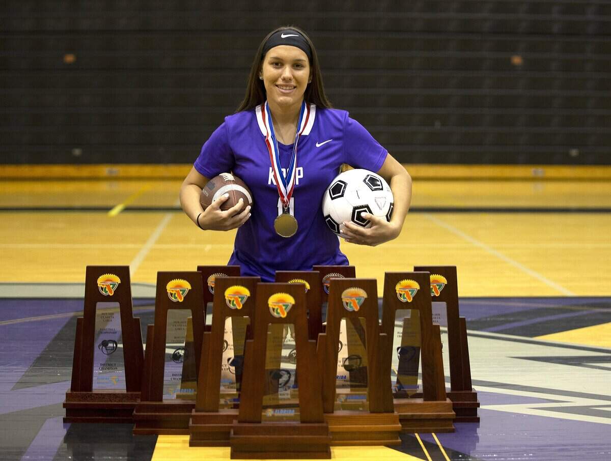 Kira Magana posed with her trophies, she is a very good flag football player Ð she made first-team All-County last year. But she also plays four other sports (soccer balls, footballs, softballs, basketballs and bowling). She has a 4.5 GPA and is interested in studying Naval Architecture and Maritime Engineering. Picture taken at Krop High School in Miami Gardens.on Friday, February 28, 2020.