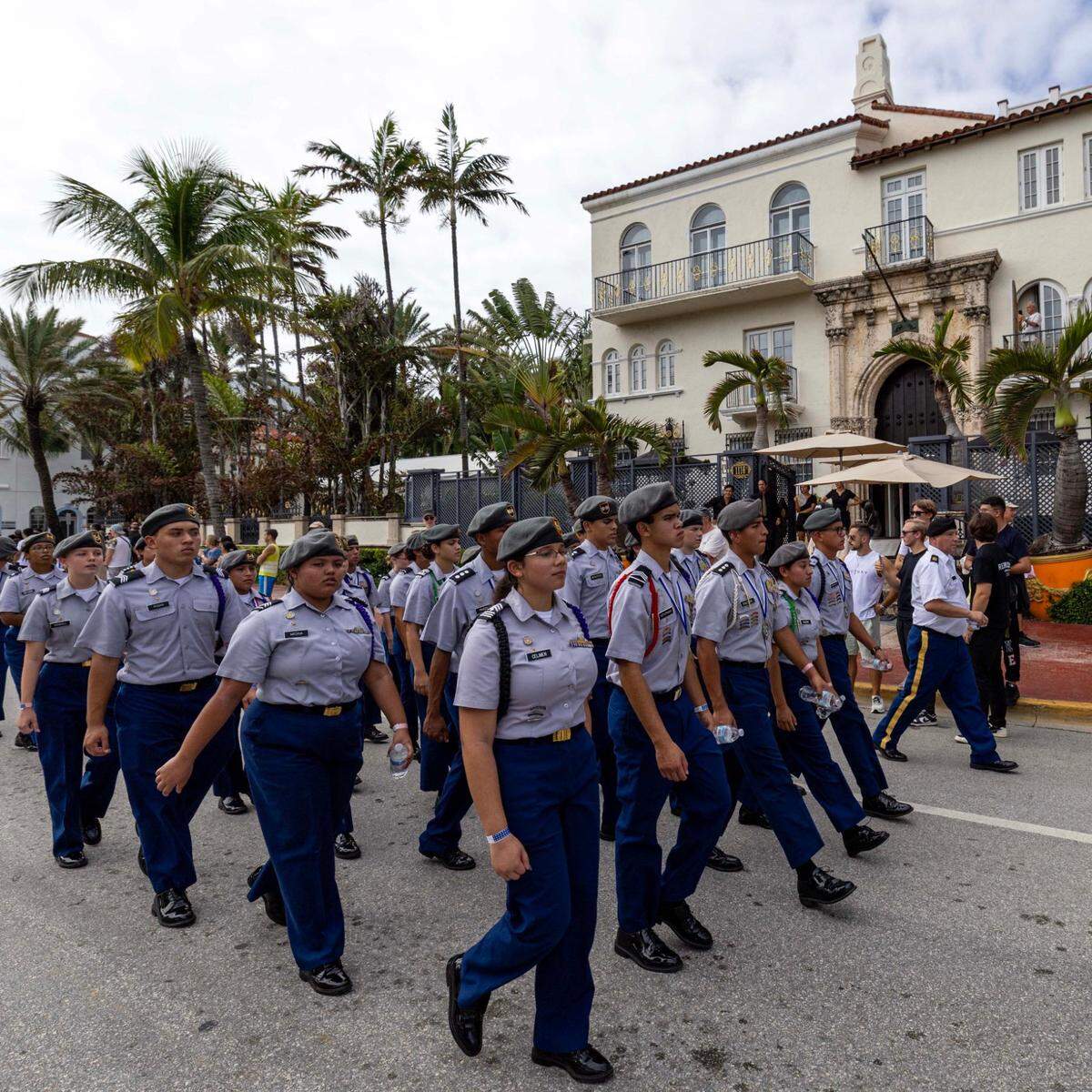 High school ROTC members march past The Villa Casa Casuarina at the former Versace Mansion during the 16th Annual Veterans Day Parade off Ocean Drive on Monday, Nov. 11, 2024, in Miami Beach, Fla.