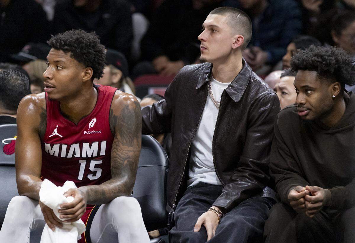 Miami Heat guard Tyler Herro (14) watches his teammates play against the Chicago Bulls in the first half of their NBA game at Kaseya Center on Jan. 31, 2026, in Miami.