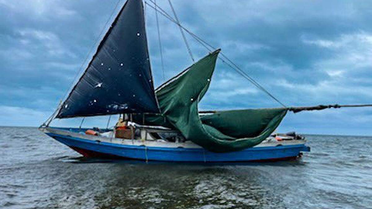 A sailboat floats in the shallow water off Card Sound Road in Key Largo Wednesday, Nov. 17, 2021. The U.S. Border Patrol said at least 61 migrants from Haiti were on the vessel.