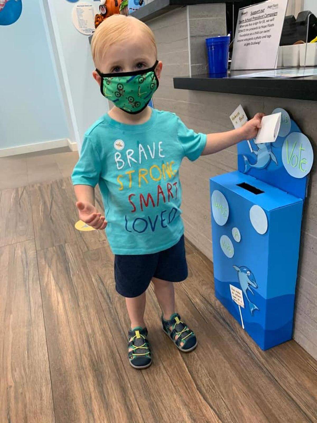 Evan&nbsp;Sumberg, 2 ½, casts his ballot in the Let’s Vote/'Vamos a Votar' at the Ocaquatics swim school location in Coral Gables. 