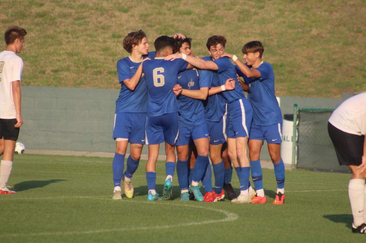 Cypress Bay’s Massimo Natoli is mobbed by his teammates following his second half goal that put the Lightning up 3-1. Cypress Bay prevailed 4-1 over Tampa Plant to win the Class 7A state championship on Saturday at Spec Martin Stadium in DeLand.