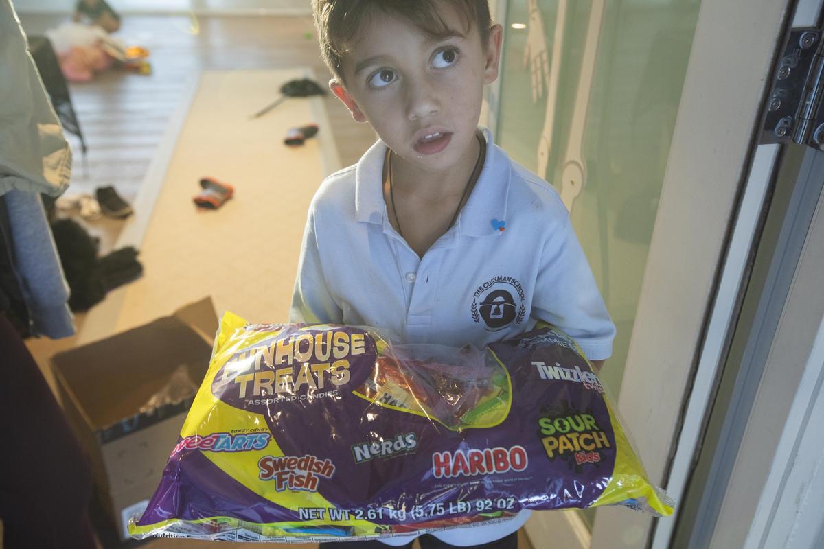 Phillip Gonzalez, 6, holds a bag of candy at his house in Lakeview on Monday, Oct. 29, 2018. His mother bought 12 bags of candy but said it likely won’t be enough for all of the trick-or-treaters.
