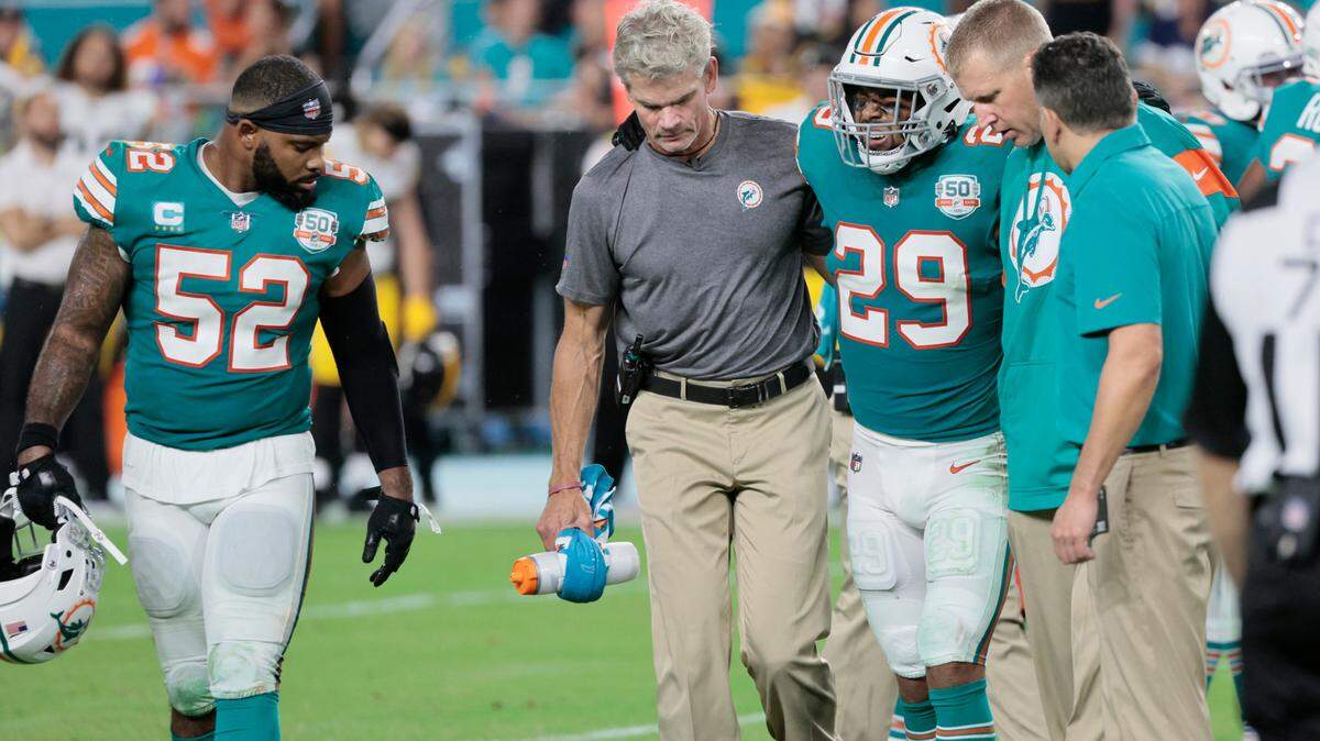 Miami Dolphins safety Brandon Jones (29) is assisted off the field during game against the Pittsburgh Steelers at Hard Rock Stadium in Miami Gardens on Sunday, October 23, 2022.