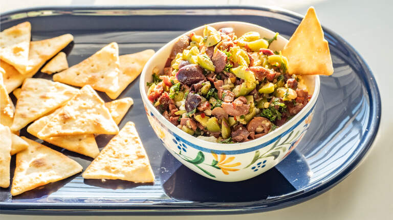 This Warm Feta Dip with Marinated Olives is an easy, crowd-pleasing appetizer