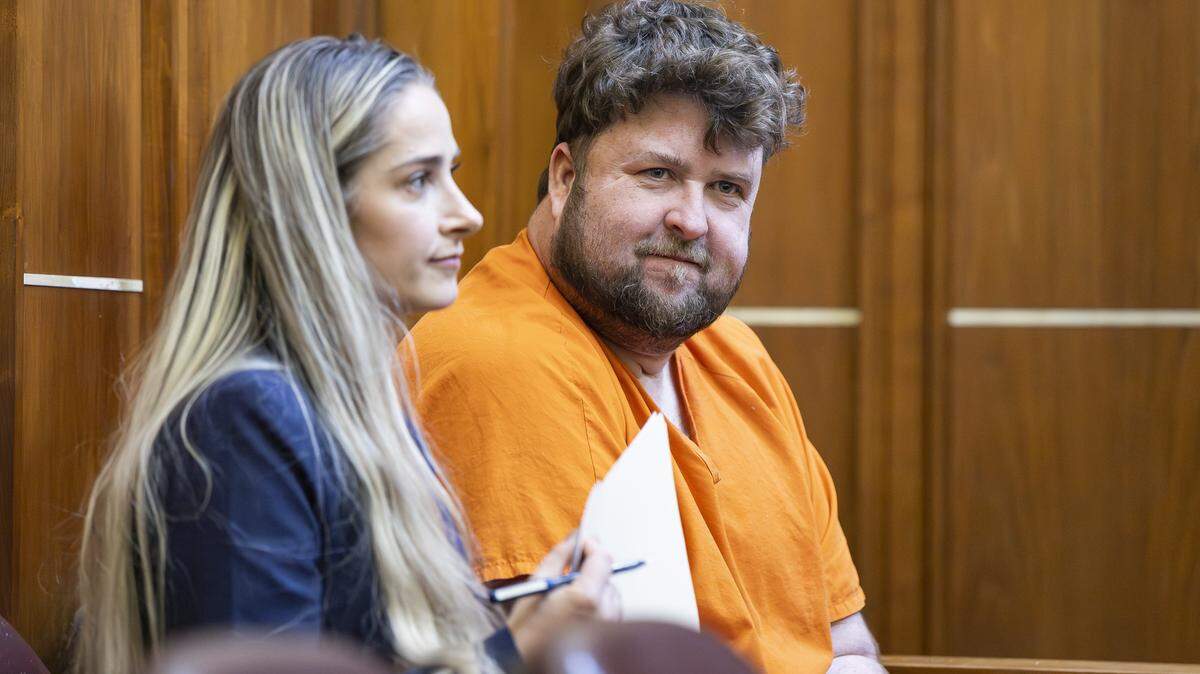 Travis Grafe, son of the former Knaus Berry Farms owners, sits next to his attorney Lauren Dawson while attending court for a competency hearing at the Richard E. Gerstein Justice Building on Friday, Sept. 26, 2025, in Miami, Fla. He is accused of beating his mother, Rachel Knaus Grafe, to death.
