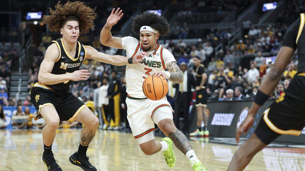 ST LOUIS, MISSOURI - MARCH 20: Tre Donaldson #3 of the Miami (FL) Hurricanes dribbles the ball against T.O. Barrett #5 of the Missouri Tigers during the second half in the first round of the 2026 NCAA Men's Basketball Tournament at Enterprise Center on March 20, 2026 in St Louis, Missouri. (Photo by Jamie Squire/Getty Images)